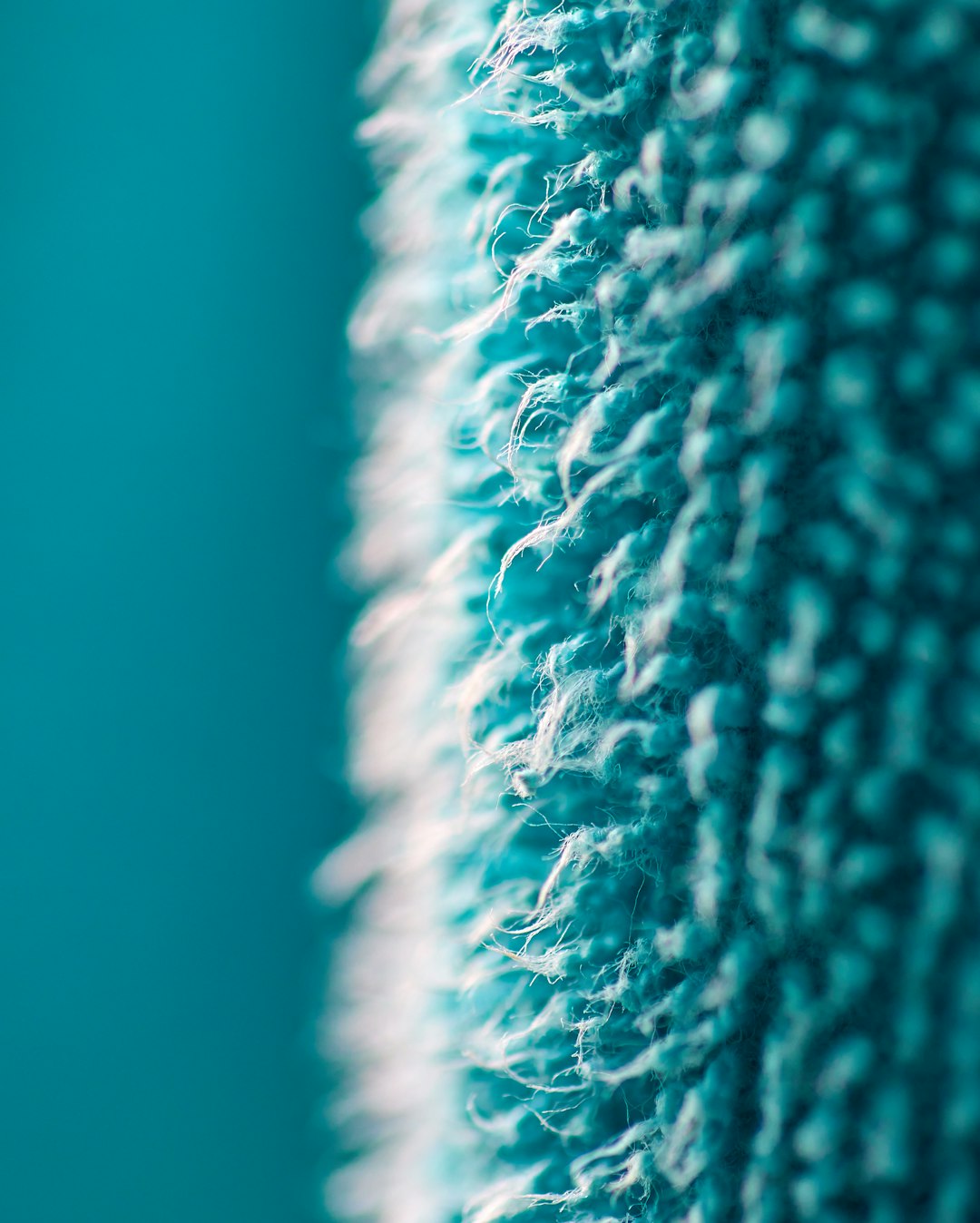 Threads of Blue/Hilos de Azul Descripción en inglés: A detailed macro shot capturing the intricate weave and soft texture of a blue towel. The focus is on the tight fibers, set against a beautifully blurred background of the same vibrant blue, creating a sense of depth and tranquility. Descripción en español: Un primer plano detallado que captura la textura suave y el entrelazado de una toalla azul. El enfoque está en las fibras de cerca, sobre un fondo del mismo azul vibrante, creando una sensación de profundidad y calma.